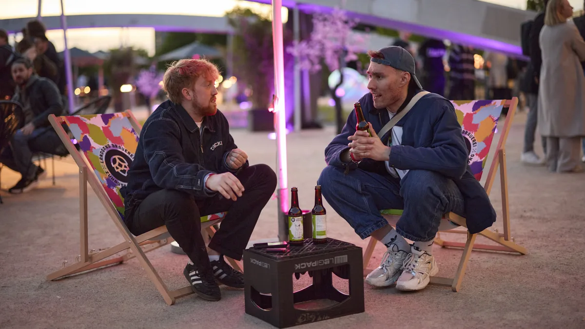 Chill vibes in deck chairs under purple neon lights